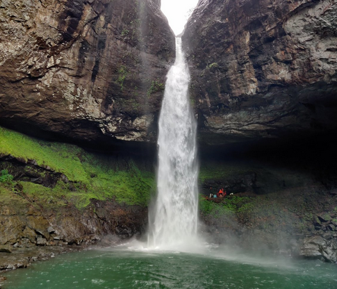 Majestic waterfall cascading into a serene pool