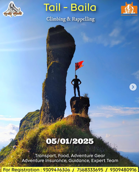 Person on rocky peak with flag at Tail Baila