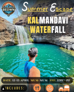 Person exploring Kalmadavi Waterfall in summer.
