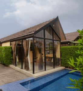 Modern glass cabin with poolside view