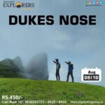 Two hikers at Dukes Nose cliff in August.