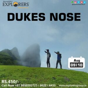 Two hikers at Dukes Nose cliff in August.