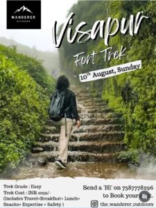 Person hiking Visapur Fort trek under misty conditions.