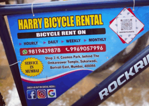 Harry Bicycle Rental sign with contact details in Mumbai.