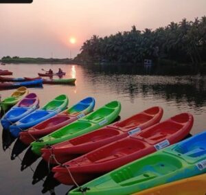 Colorful kayaks on lake with sunset view