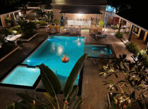 Cozy outdoor pool area with night lighting.