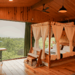 Cozy cabin bedroom with forest view.