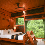 Cozy wooden cabin bedroom with nature view