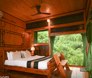 Cozy wooden cabin bedroom with nature view