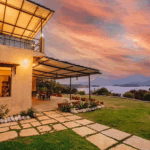 Lakeside house with sunset view and garden