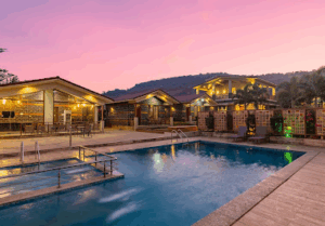 Resort pool and buildings at sunset