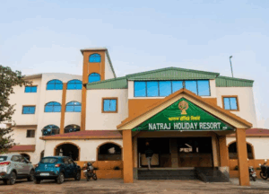 Natraj Holiday Resort entrance with parked vehicles