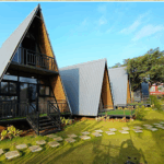 Modern triangular cabins with scenic surroundings.
